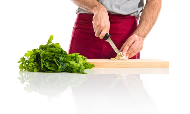chef preparing a bowl of salad